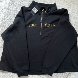 Nike woman’s black and golden sweatshirt
